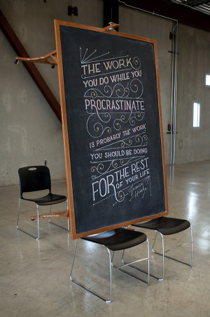 Students covertly design inspirational quotes on class chalkboard