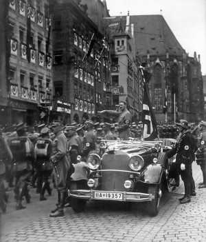 Adolf Hitler viewing a parade of SA troops in Nuremberg, Germany, in ...