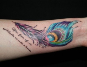... colorful peacock feather. The peacock feather tattoo is inked on