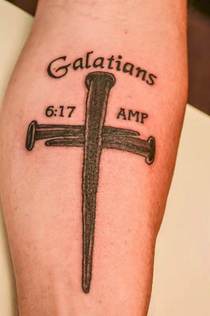 19 galatians 6 17 and cross on arm