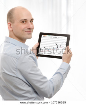 business man using a touch screen device with Stock Quotes - stock ...
