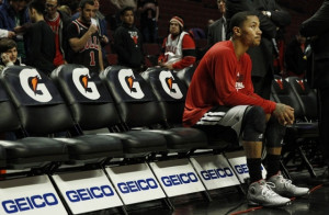 Chicago Bulls' Derrick Rose takes a break on the bench during the warm ...