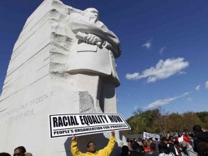 Demonstrators rally under the new Martin Luther King Jr. memorial in ...