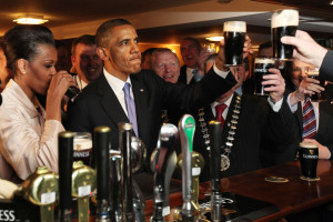 Slainte! The president toasts with a pint of Guinness. Michelle Obama ...