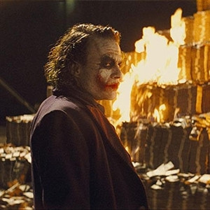 The joker burning money - caption image