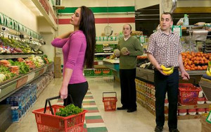 Two men looking at woman in a supermarket: Men spend a year staring at ...