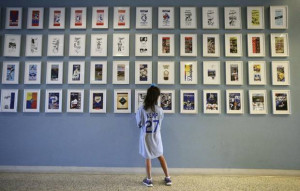 Six-year-old Larissa Martin looks at Los Angeles Dodgers yearbook ...