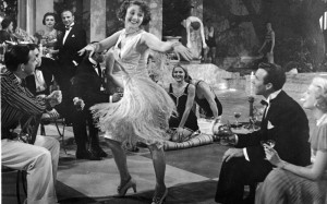 An unidentified woman wearing a 'flapper'- style skirt dances at a ...