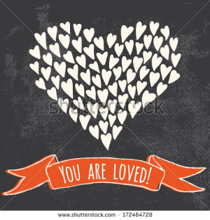 arranged in shape of a heart with red ribbon and 