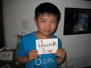Perry Chen holding Thank-You card he designed (photo by Zhu Shen)