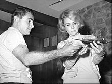 Rod Serling modeling an airplane with actress Inger Stevens , 1960