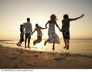 Family Jumping on Beach