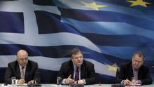 Greece's Finance Minister Evangelos Venizelos, centre, addresses ...