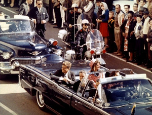 Mr. and Mrs. John F. Kennedy, and Texas Governor John Connally ride ...