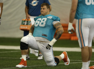 Miami Dolphins guard Richie Incognito (68) stretches during an NFL ...