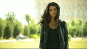 Three excited adult pretty young women air quotes and smiles.