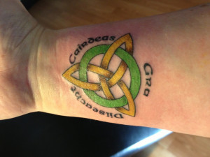 Celtic tattoo...the words in Gaelic: love, loyalty, friendship