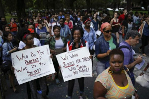 Above, Ferguson, Missouri, residents hold a vigil for slain teenager ...