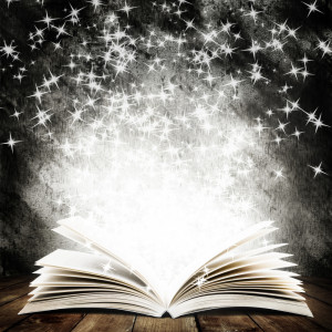 Old open book with magic light and falling stars on wood planks and ...