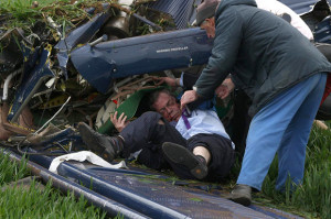 Farage being pulled from the wreckage by UKIP PR man Duncan Barkes and ...