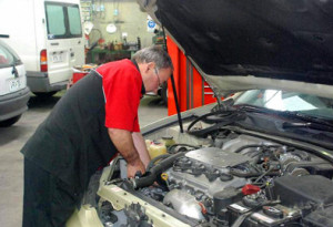 Richmond Car Service Matlin Auto Mechanic Checks Engine Measurements 2