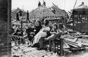 Ruined: In Liverpool, 68-year-old Sarah Manson sits outside her bombed ...