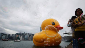 of a giant rubber duck created by Dutch artist Florentijn Hofman ...