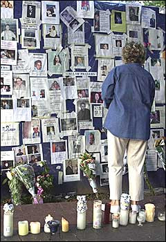 On Sept. 15, a woman examines a wall at New York's Bellevue Medical ...