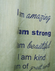 Close up on inspirational quote on pashmina scarf for her