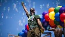 dance on a float as it passes by during the annual Vancouver Pride ...
