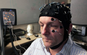 Michael Mosley with an electroencephalograph cap on to measure his ...