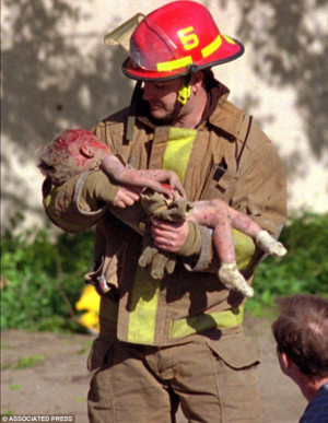 Sheltered in my arms: Oklahoma City fire Captain Chris Fields carries ...