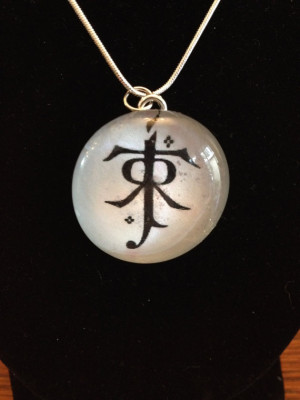 ... pendant necklace with J.R.R. Tolkien's initials in black and white