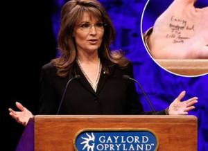 Sarah Palin uses hand notes while giving a speech at a Tea Party ...