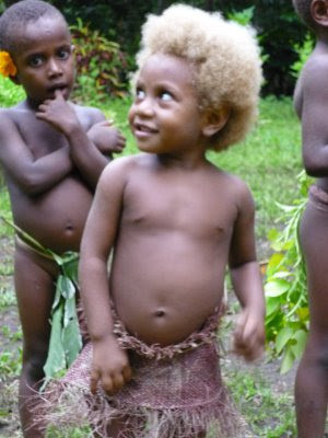 above) Young, Melanesian girl with natural blonde hair. (Source)