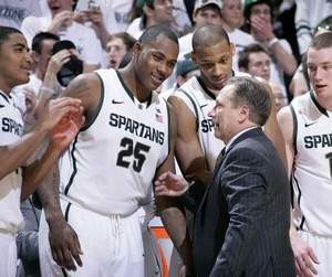 Michigan State coach Tom Izzo, foreground, congratulates Gary Harris ...