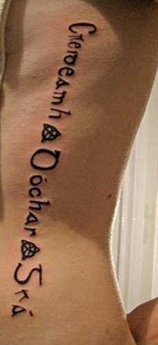 Gaelic symbol tattoo on man's left side of his body.