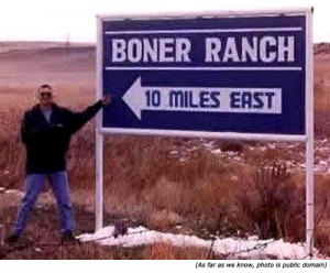 boner ranch 10 miles east man standing next to big boner ranch sign ...