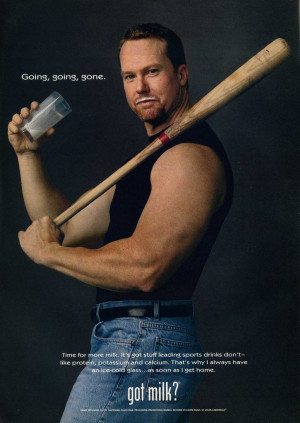 ... baseball player Mark McGwire posed with a bat for his 