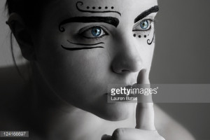 black face paint caption portrait of young woman with white and black ...