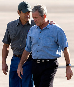 George W. Bush, right, talks with Texas Gov. Rick Perry in Houston ...