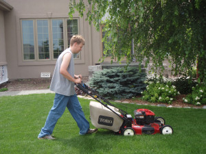 Girl Mowing Lawn