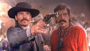 Tombstone - Michael Biehn as Johnny Ringo and Powers Booth as Curly ...