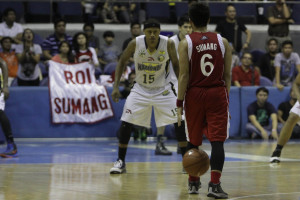 It's late in the game against NU. UE's Roi Sumang has the ball. The ...