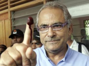 REUTERS East Timor's President Jose Ramos-Horta shows off his inked ...