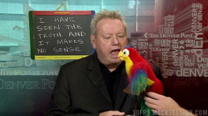 ... Woody Paige is caught talking to and befriending a robot parrot