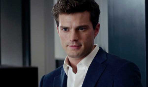 Jamie Dornan as Christian Grey in Fifty Shades of Grey