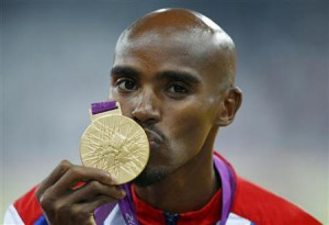 Britain's Mo Farah kisses his gold medal for the men's 5000m at the ...