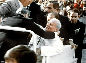 Almost fatal: Bodyguards hold Pope John Paul II after he was shot on ...