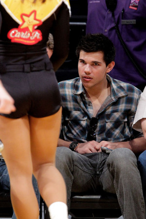 Taylor Lautner attends a game between
